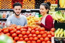 A couple shop for fresh produce.