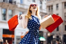 A woman smiles as she shops.