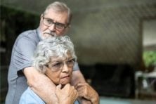 A retired couple look worried.