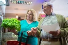 Retired couple shopping for fresh produce