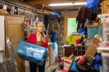 A woman declutters her garage.