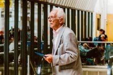 A retired man getting ready to board a flight