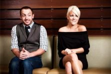 Two people look nervous on a first date.