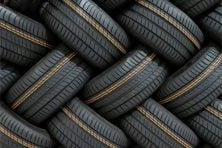 tires are piled on top of each other in this photo.