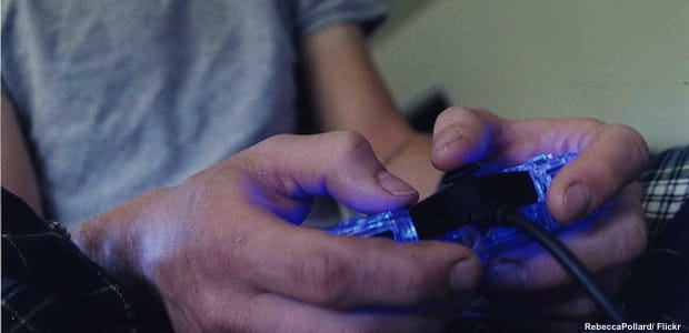 Teen playing video game
