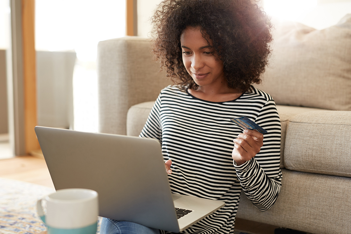 A woman uses coupon codes to get discounted prices while shopping online.