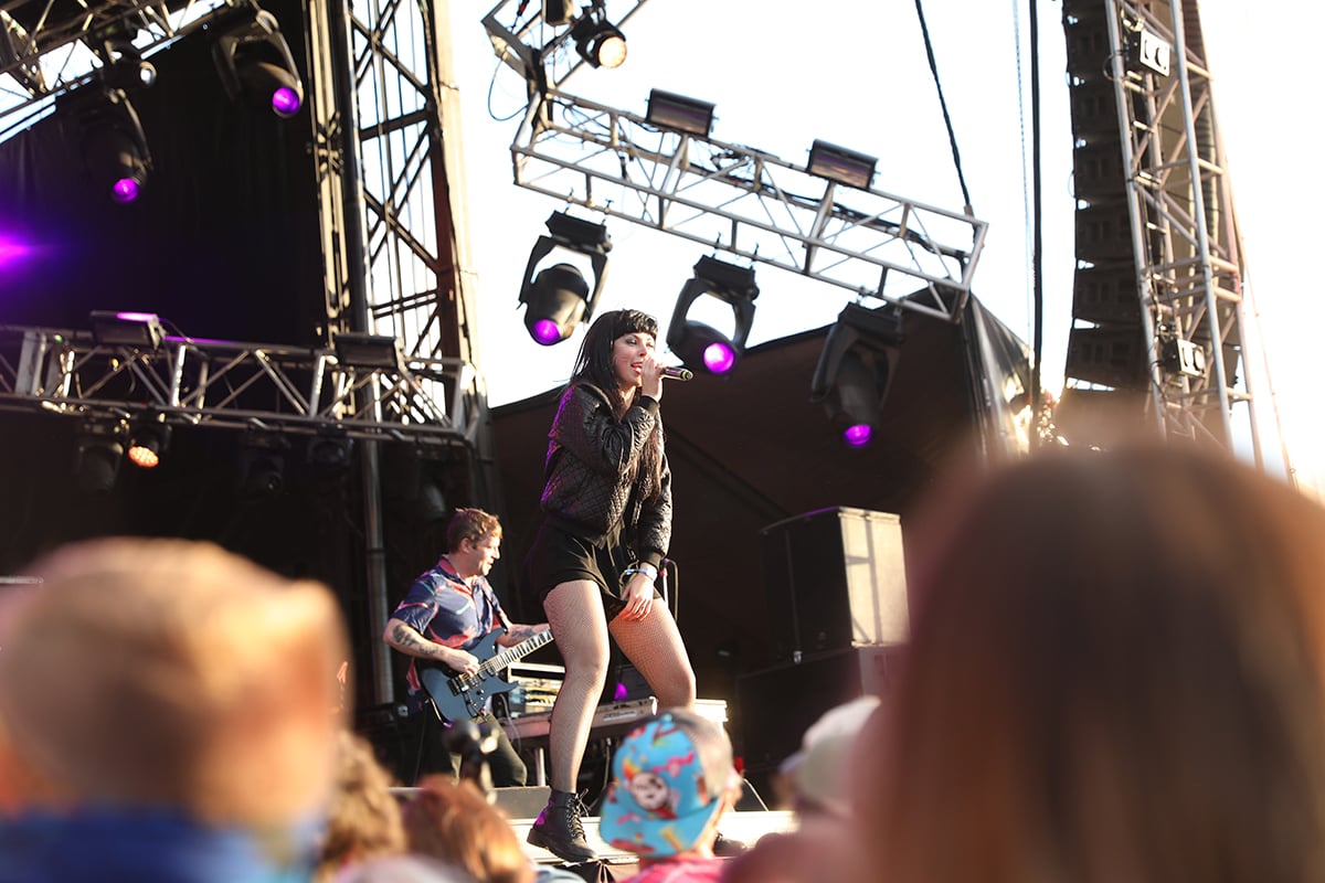 Sleigh Bells perform for fans during a concert.