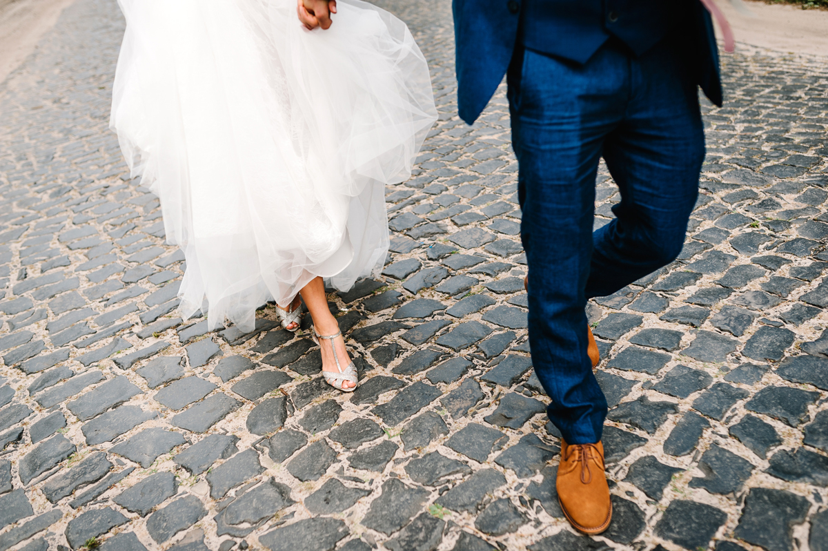 A man and wife walk on the street on their wedding day.