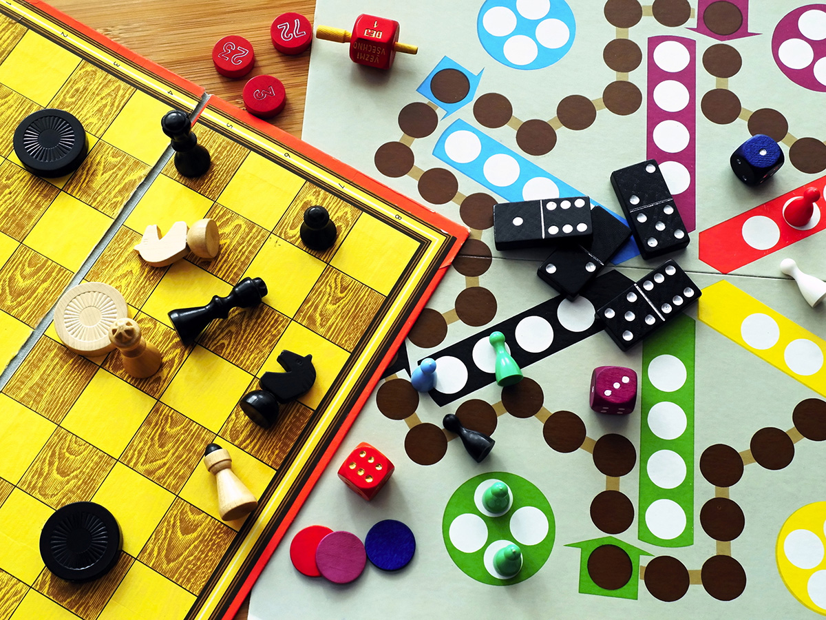 Board games are carelessly strewn across the table.