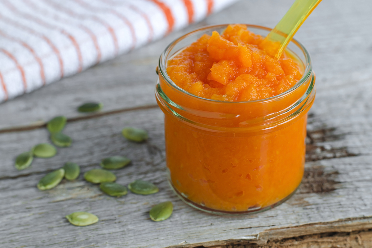 A batch of a pumpkin facial mask is made for a person to apply to their face.