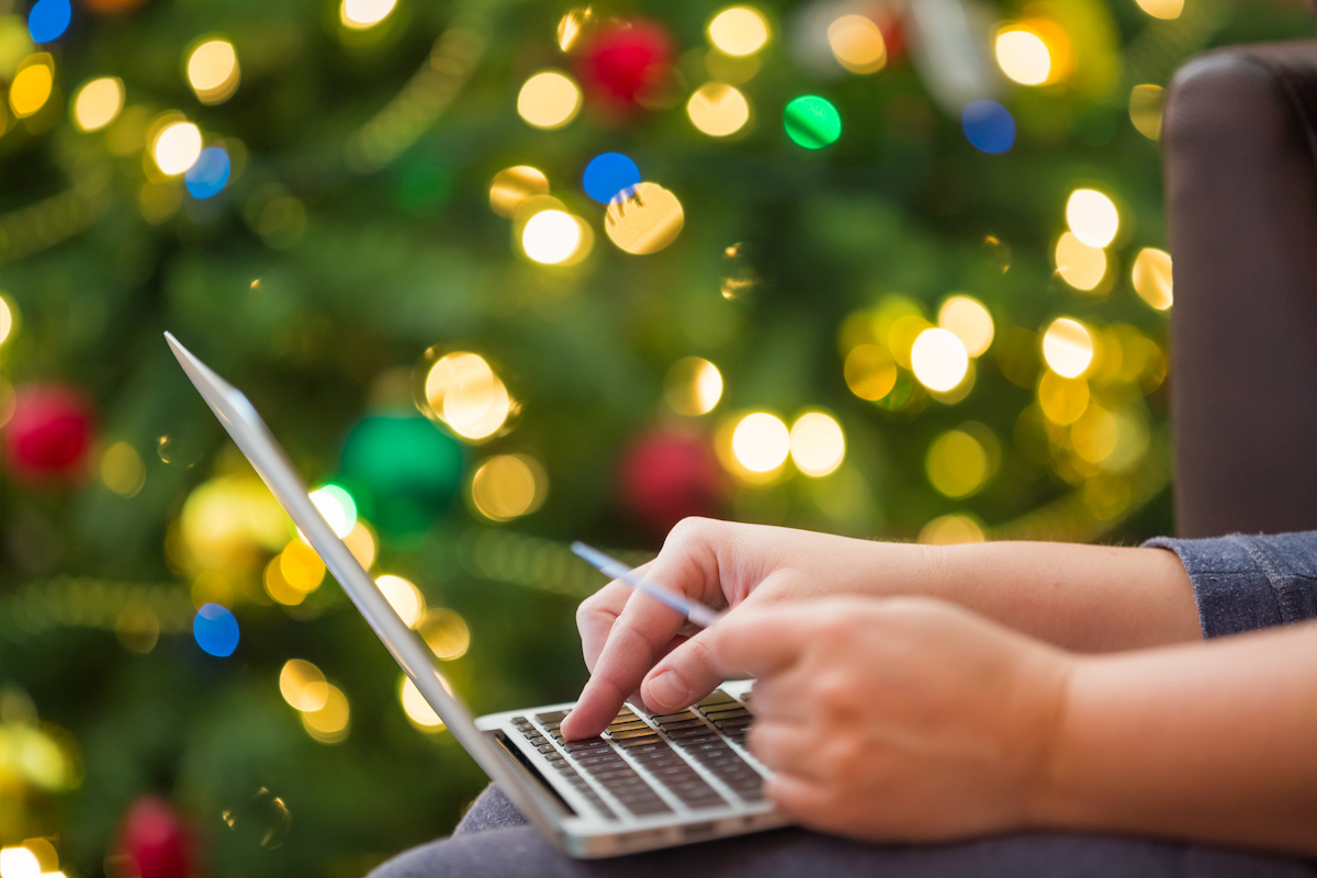 Christmas shopping using credit card and laptop