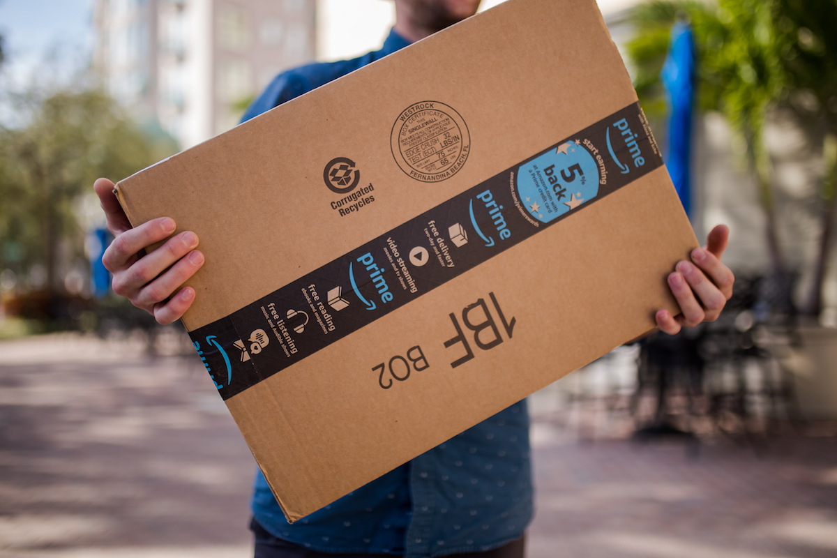 Alexander Olt carries an amazon prime package