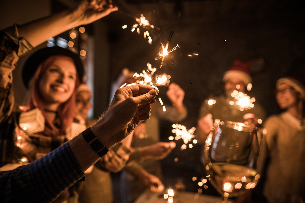 people holding sparklers
