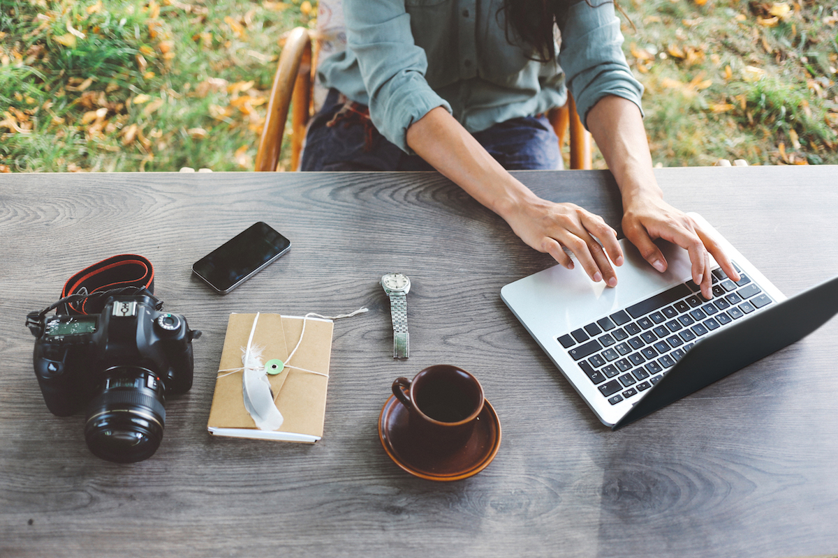 Woman researches the difference between stocks and bonds on her laptop.