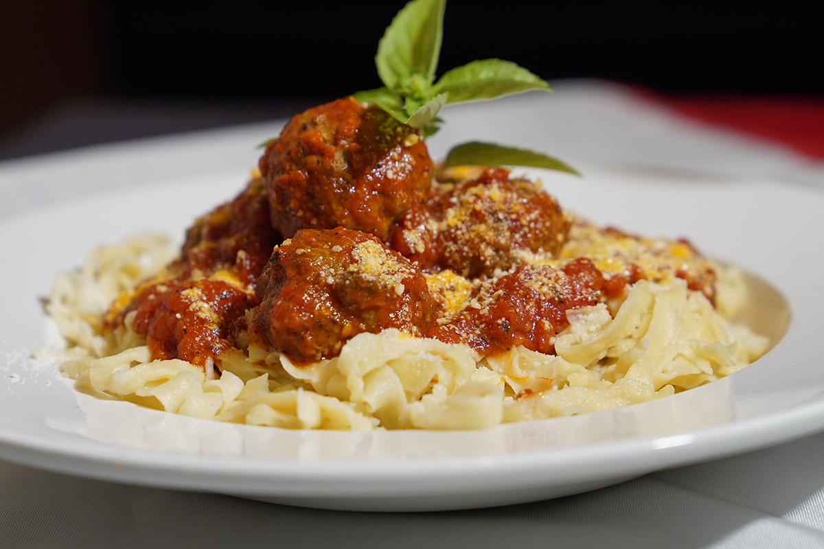 Plate of spaghetti and meatballs made from a recipe.