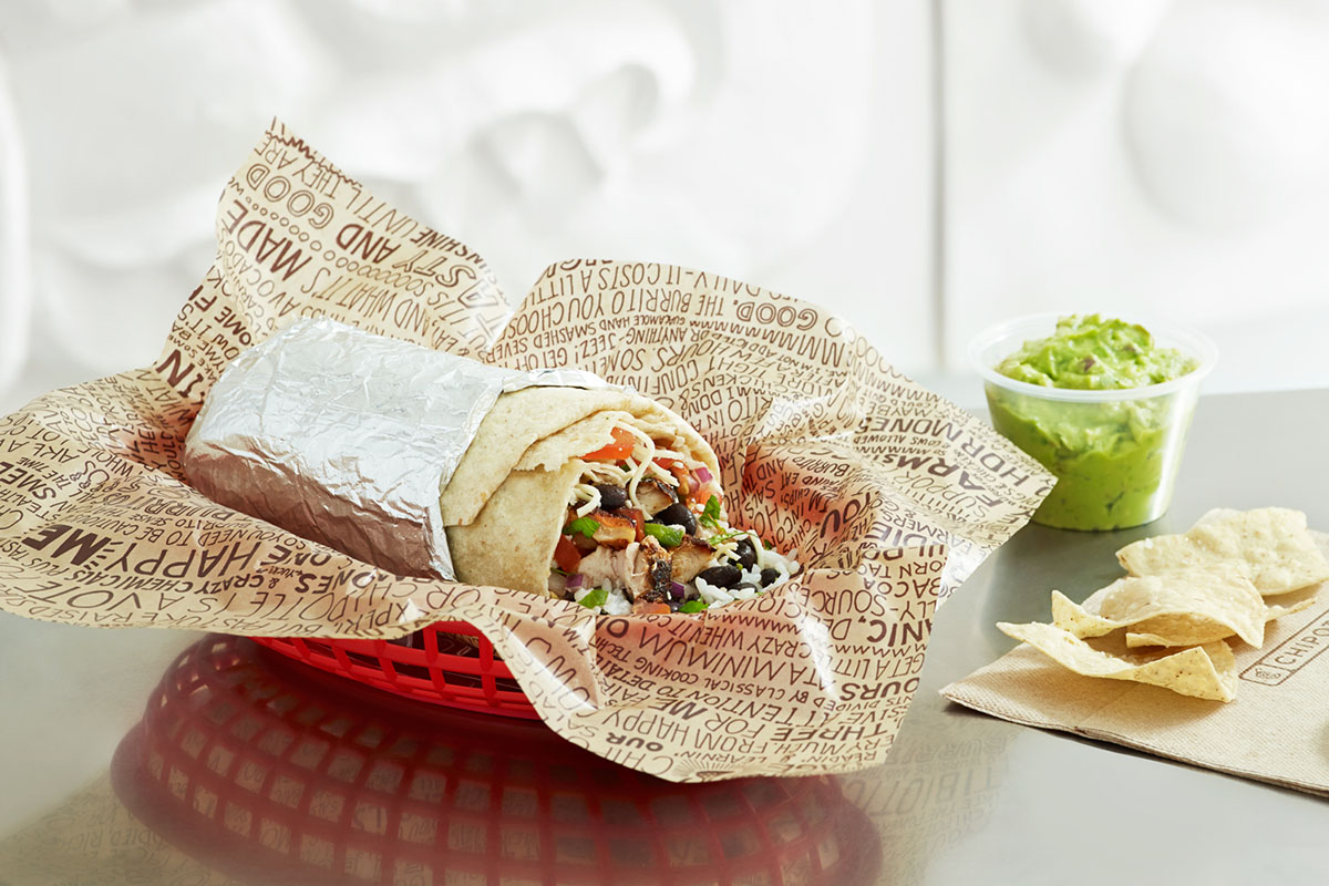 chipotle burrito with side of guacamole and chips