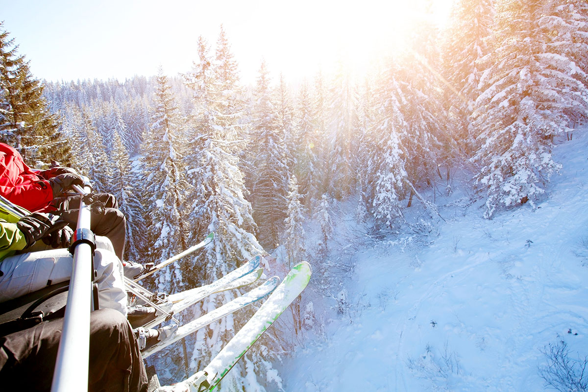 A family sits on a ski lift.