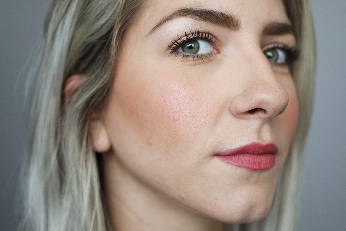 A woman wears Ultra HD Matte Lipcolor