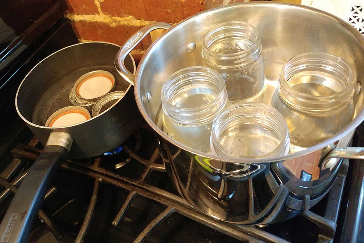 Before canning tomatoes, one must sanitize the jars first.