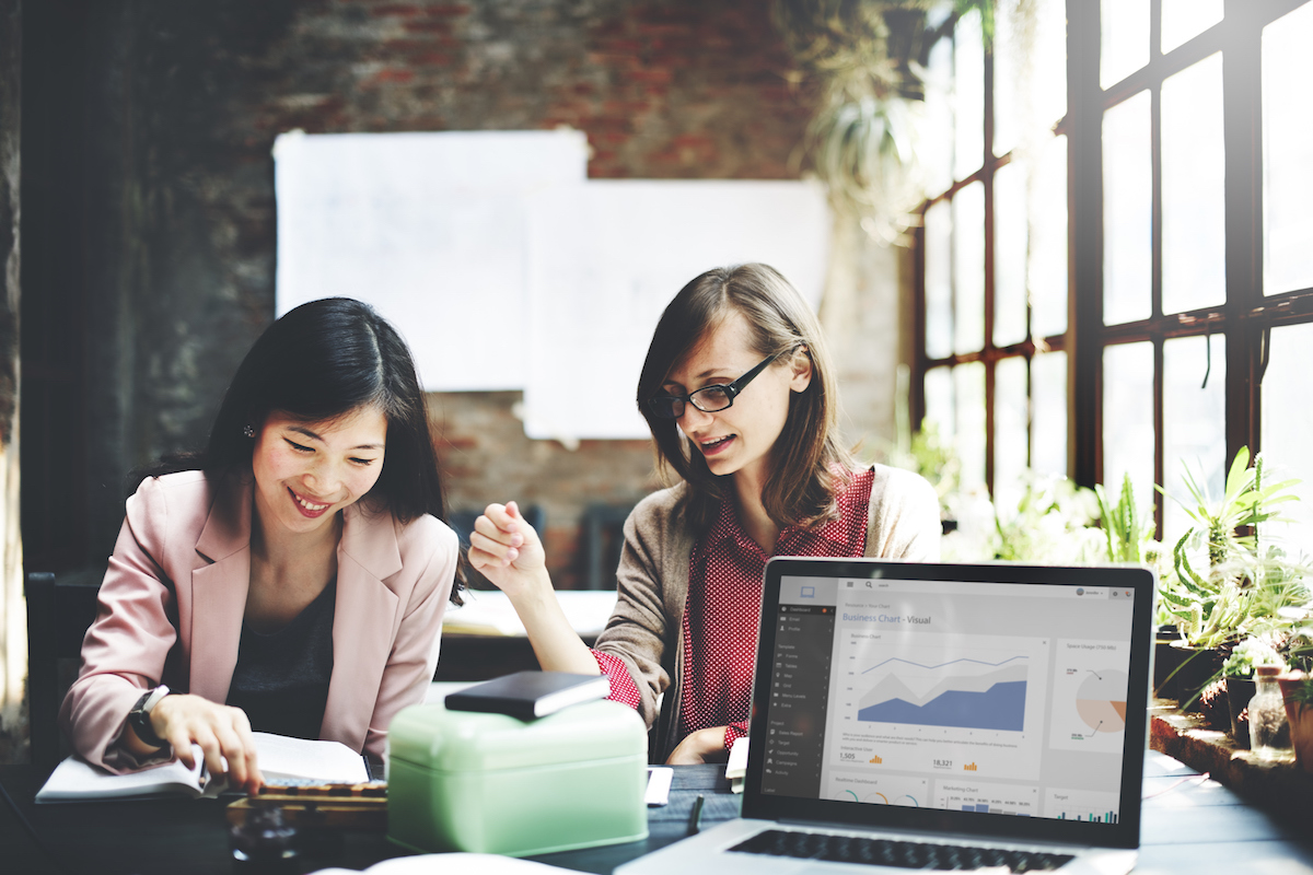 two women working together in an office