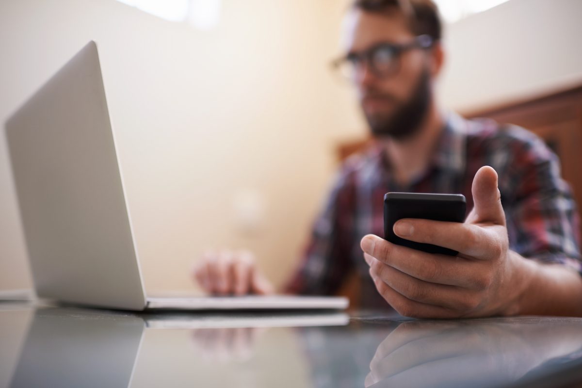 Shot of a young man working on a laptop