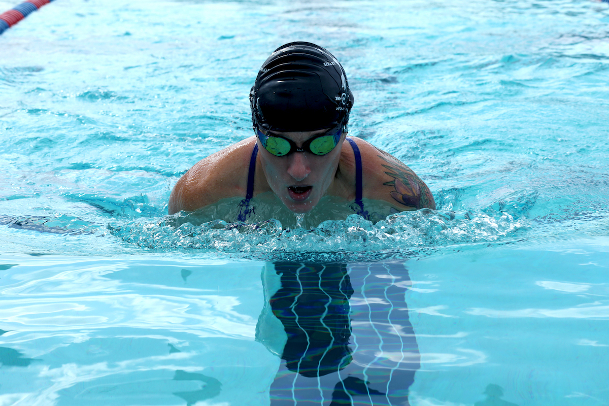 a woman swimming in a pool