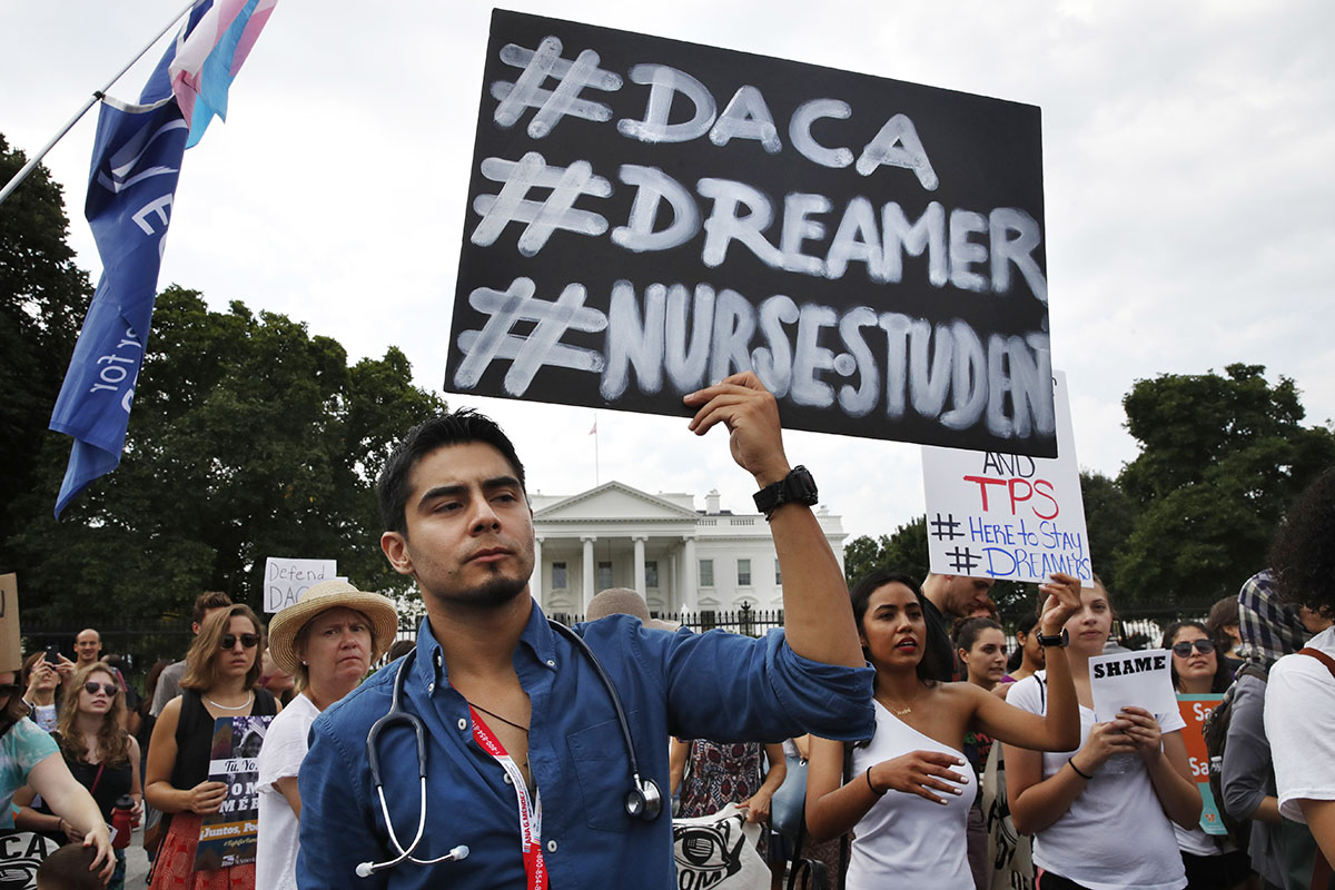 a nursing student and recipient of Deferred Action for Childhood Arrivals rallies with others in support of DACA outside of the White House