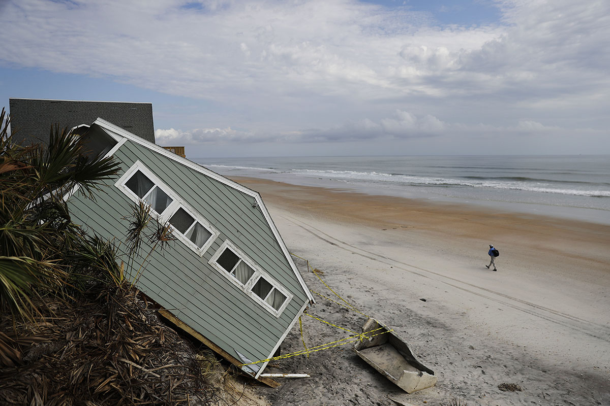 A house rests on the beach after collapsing off a cliff from Hurricane Irma in Vilano Beach, Florida, Friday, Sept. 15, 2017.