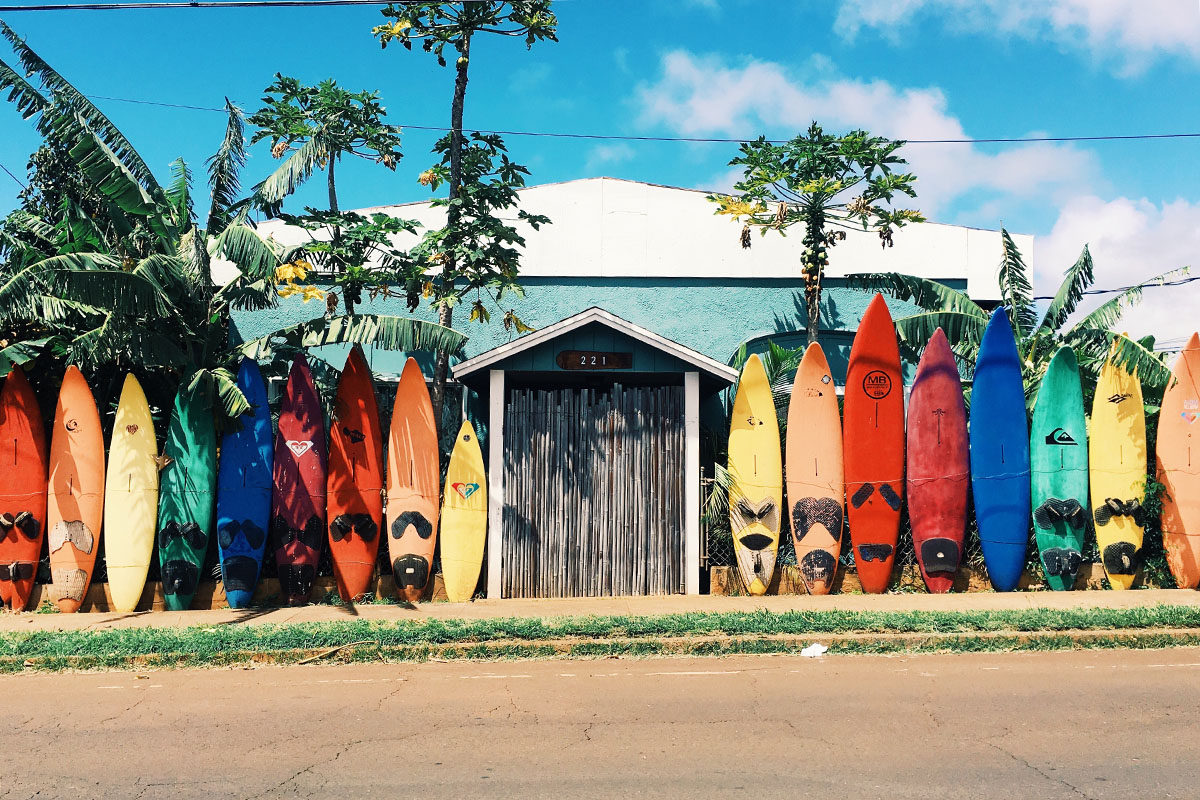 surfboards leaning against shack