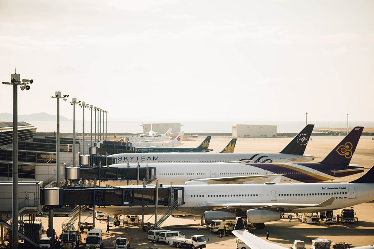 airplanes parked at gates at the airport