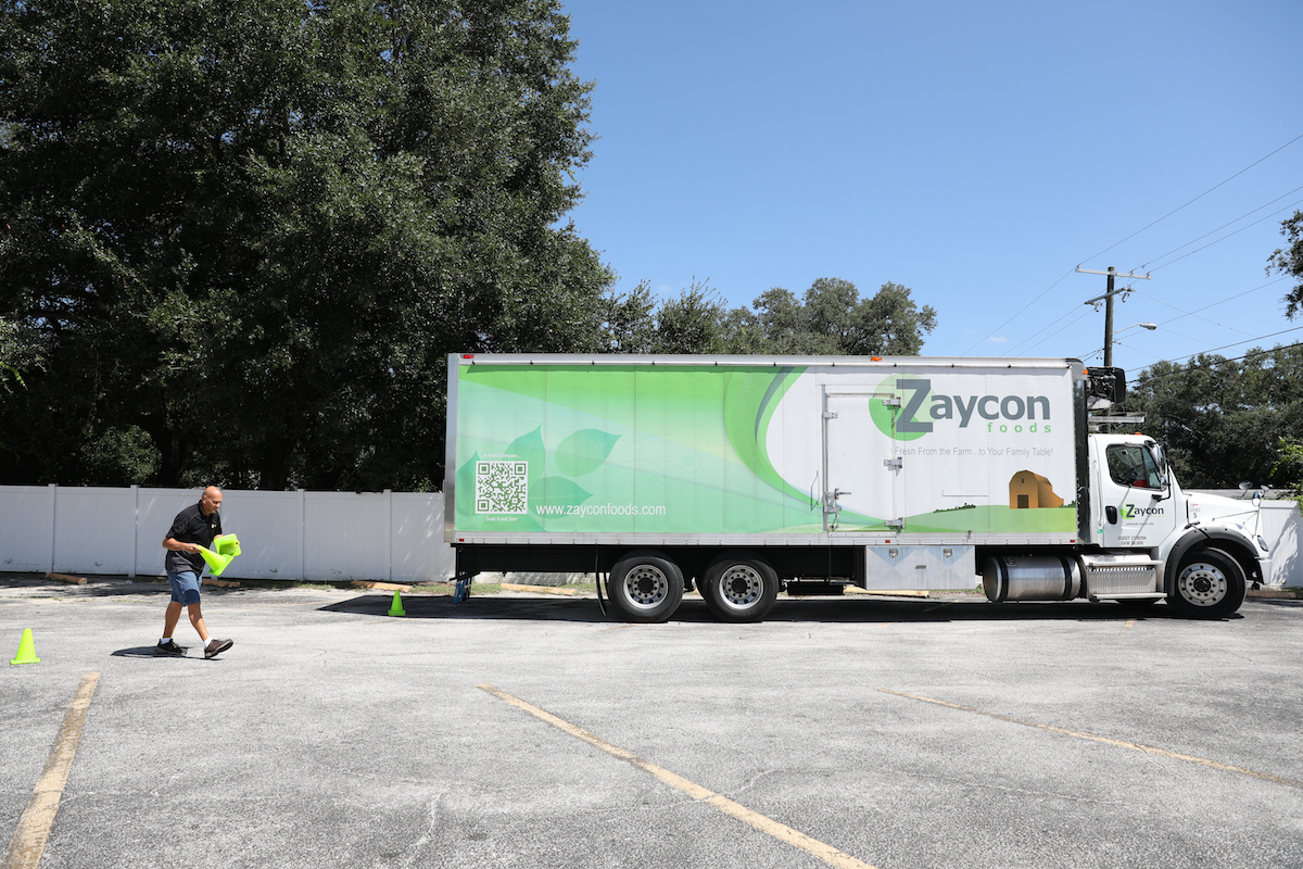 Truck driver Jim Stephenson of Spokane, Washington gets ready to distribute product to customers in Tampa, Florida. Sharon Steinmann/The Penny Hoarder