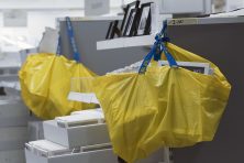 Ikea bags hang on shelves in the new IKEA furnishing store in Magdeburg, Germany
