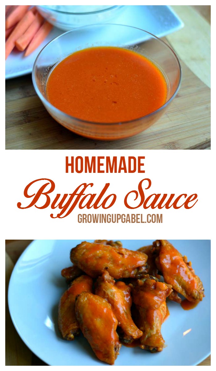 homemade buffalo sauce in a glass bowl next to a plate of chicken wings