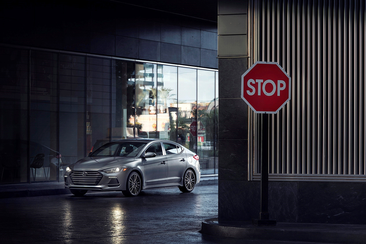 A 2018 Elantra Sport is pictured in an urban setting.