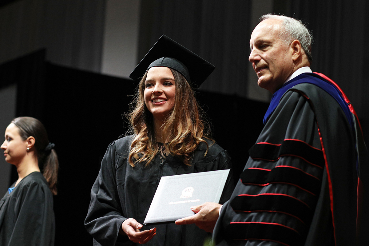 Kelly Smith receives her diploma during the University of Tampa college graduation at the Florida State Fairgrounds in Tampa, Fla Saturday, May 6, 2017.