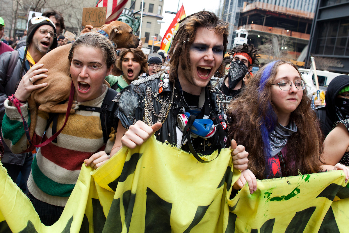 Occupy Wall Street demonstrators march near Zuccotti Park on March 17, 2012 in New York. AP Photo/John Minchillo