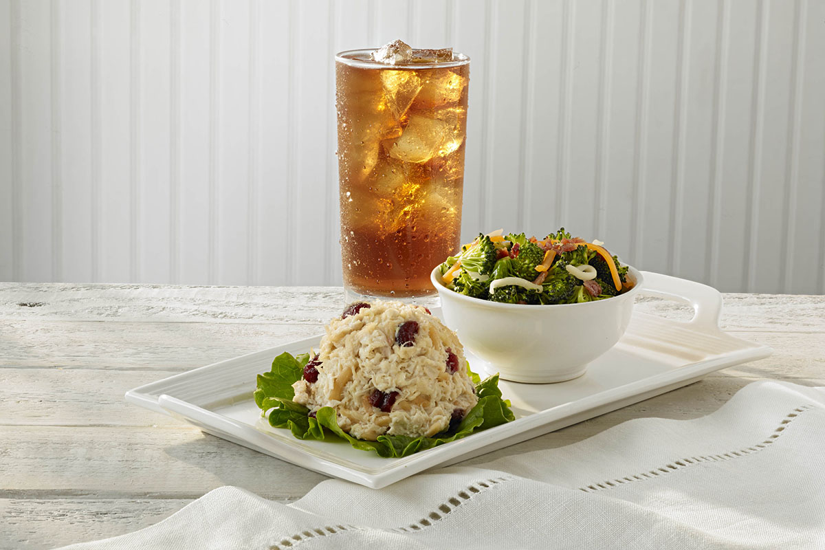 scoop of chicken salad and beverage on table