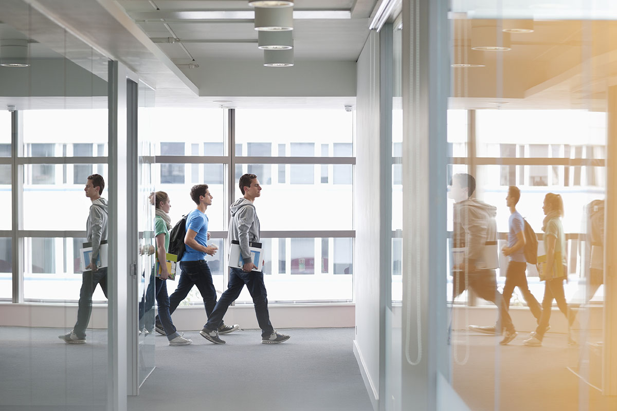 college students walking in corridor