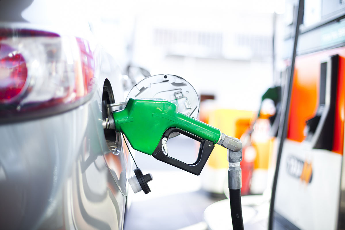 A close-up of a car being filled with gas