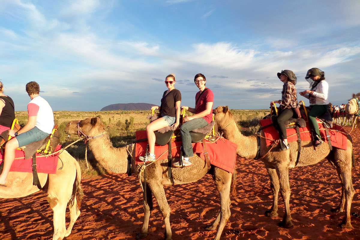 Lucy and a friend sitting on a camel