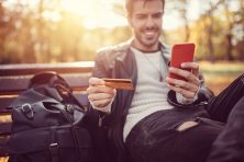 Young man making credit card payment online