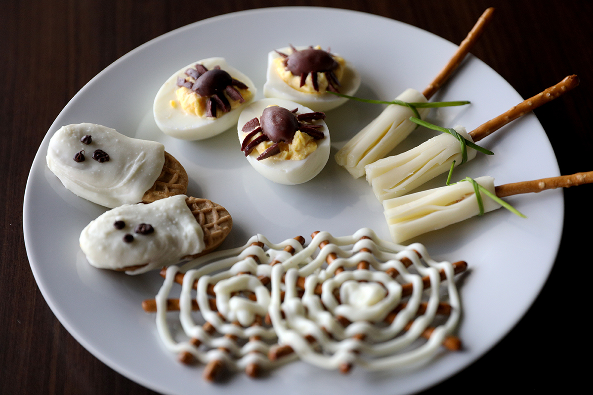 Homemade Halloween treats sit on a plate.