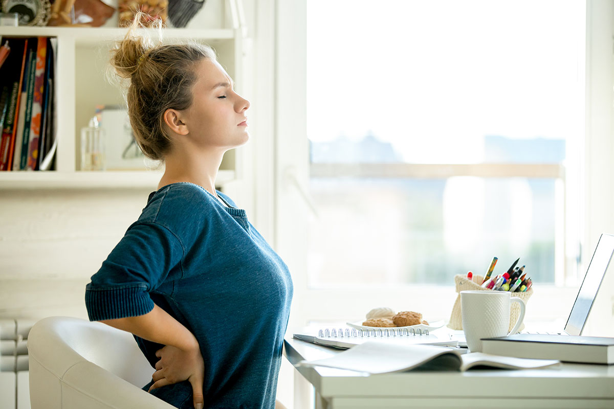Portrait of a woman at the table backache pose