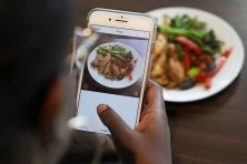 Desiree Stennett, TPH staff writer, takes a photo of her Whole 30 compliant lunch for Instagram in St. Petersburg, Fla., on October 26, 2017.