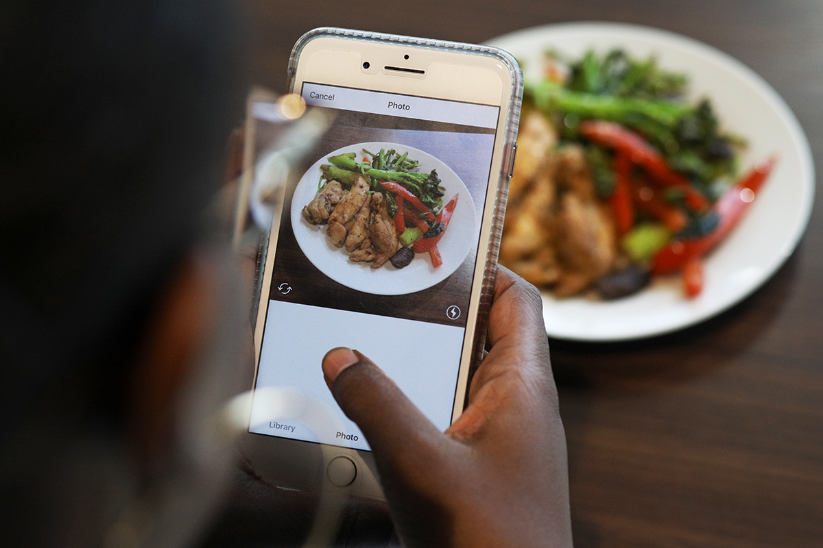 Desiree Stennett, TPH staff writer, takes a photo of her Whole 30 compliant lunch for Instagram in St. Petersburg, Fla., on October 26, 2017.