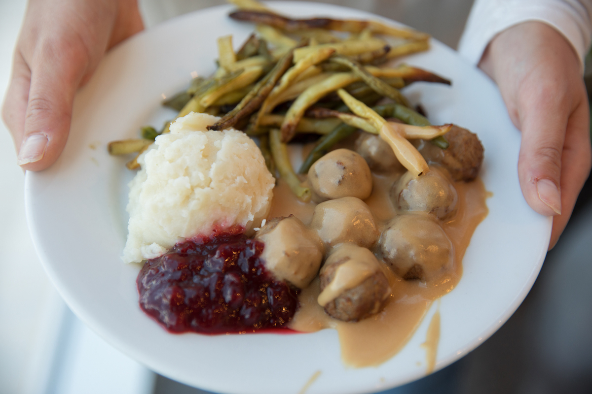 a plate with meatballs and vegetables from ikea