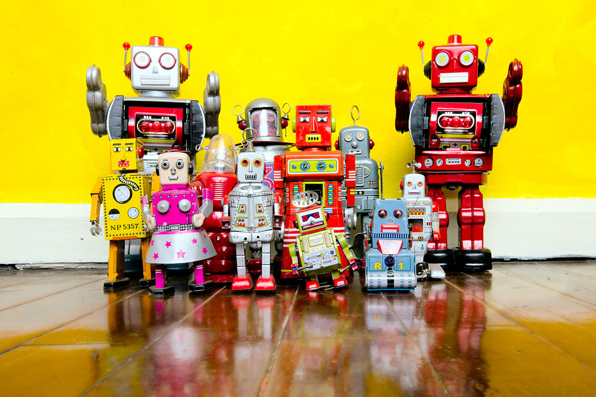 retro robot toys on a wooden floor