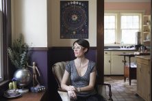 A woman poses for a portrait in her home in DeLand, Fla.