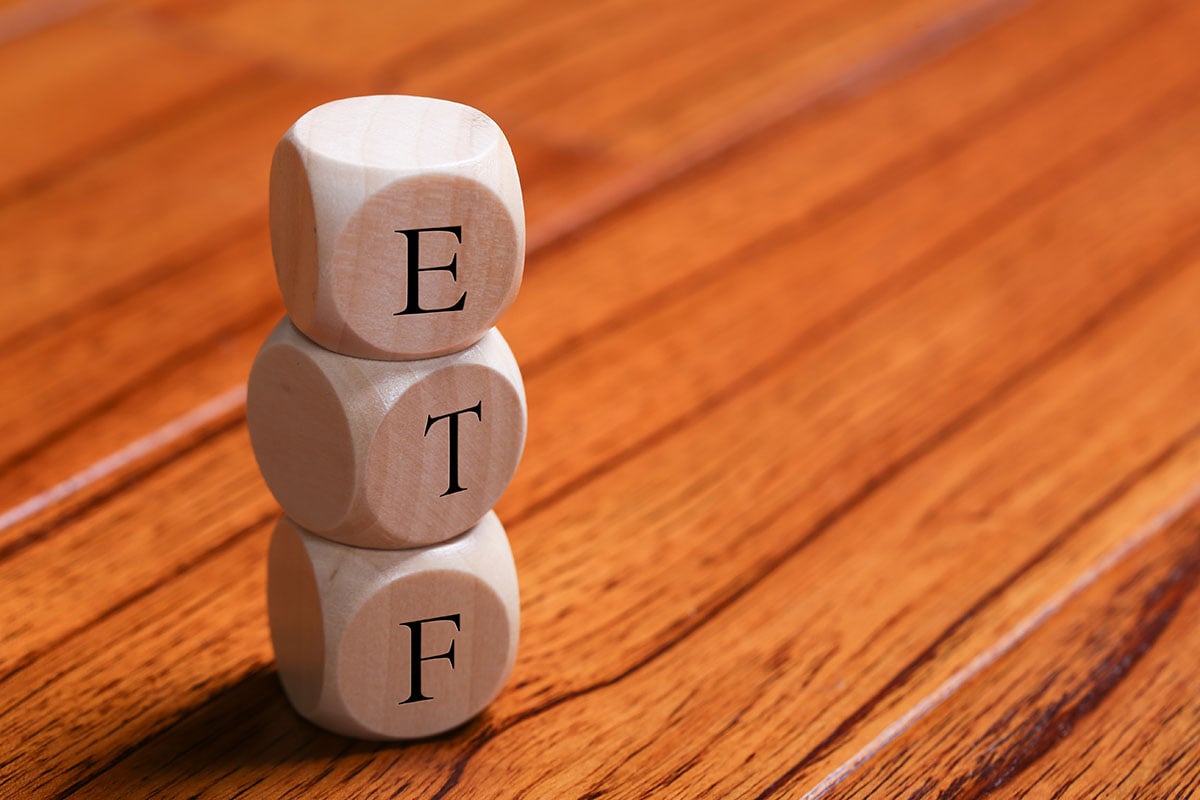 ETF wooden blocks are on the wooden floor background.