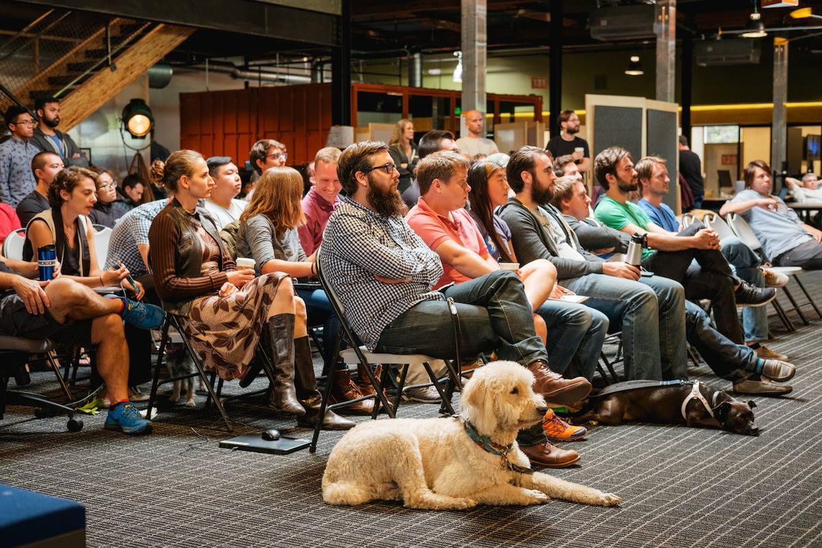A dog attends a meeting with its owner at Procore Technologies.